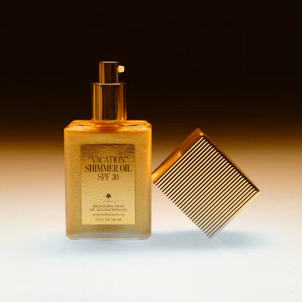 Vacation Shimmer Oil SPF 30 reef-safe sunscreen to deliver a radiant glow with lightweight shimmer and sun protection at The Skyn Distillery Wayzata Minnesota